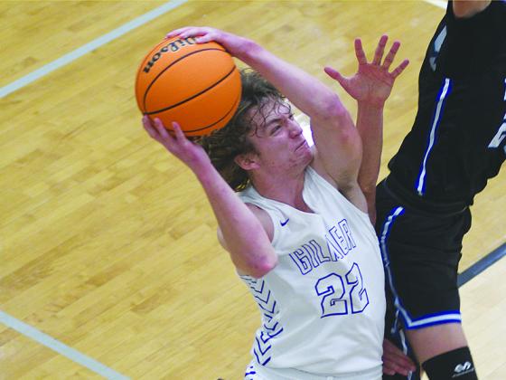 Braden Jenkins drives for two points and scored 14 in Gilmer’s win over West Hall last Friday.