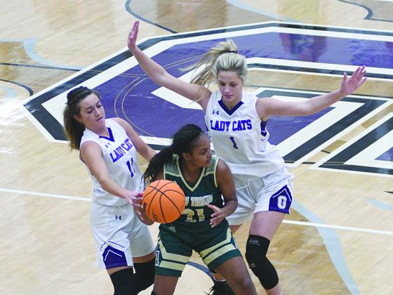 Lady Cats Beth Burnette (11) and Elly Callihan (1) apply defensive pressure, which has been a hallmark of Gilmer’s success this season.