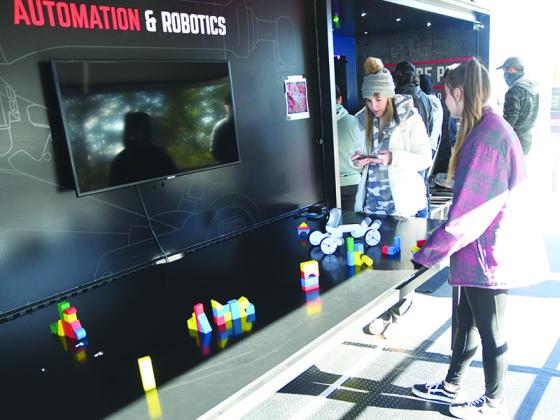 Gilmer High student Reagan Boling operates a robot last Firday at Be Pro Be Proud Georgia’s mobile workshop that seeks to teach students about skilled technical career paths.