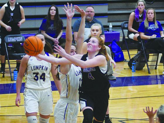 Gilmer High School senior Hope Colwell drives to the basket for two points with less than a minute to play in last Tuesday’s region championship against the Lumpkin County Indians. 