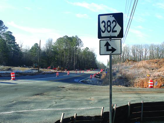 Orange barrels and heavy equipment line the intersection of Old Highway 5 and Highway 382, where construction of a connecting route between 382 and Highway 515 continues.