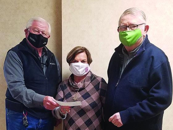 Tom Porter, Pickens County Sportsman’s Club president and past chairman of the Kids Kottage Commission, left, presents a donation check to Judge Brenda Weaver and Kids Kottage Commission Treasurer Don Van Landingham.