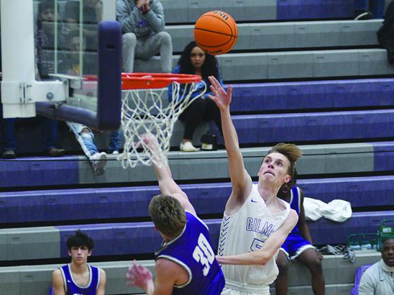 Brady Sanford drives for two points and scored 11 versus North Hall last Tuesday.