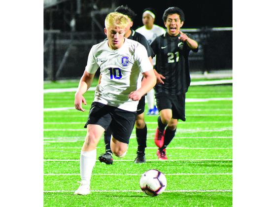 Bobcat Julien Withrow races downfield versus North Hall last Friday and scored two goals on the week.