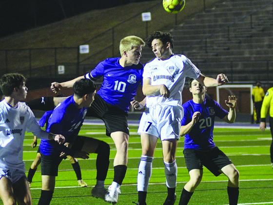 Bobcat Julien Withrow (10) goes up for a header against White County and scored Gilmer’s goal in the first half last Wednesday.
