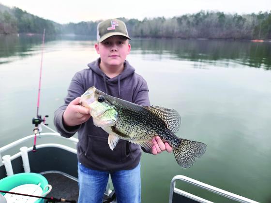 Chandler Watkins is pictured with the record-setting white crappie he caught on Carters Lake.