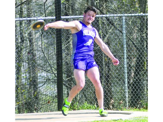 Gilmer High siblings Cole Ellis (below), Logan Ellis (above) and Sierra Ellis (bottom). At last Tuesday’s home meet, Logan darts out of the blocks in the 100-meter dash as coach Josh Snider looks on, Logan throws the discus, and Sierra hits the midway point of the girls 100-meter dash. The senior trio all placed at last Friday’s Mt. Yonah Invitational as Cole was sixth in the 100, Logan finished second in the discus and Sierra was seventh in the 100.
