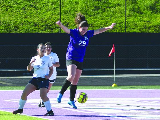 Lady Cat senior Olivia Lykins gains possession inside the box versus West Hall last Friday and scored two goals in Gilmer’s victory.