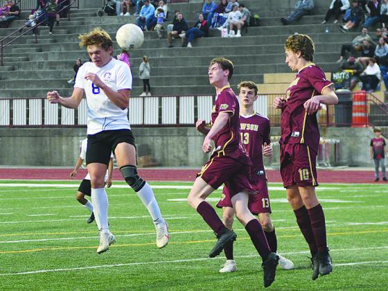 Gilmer senior John Nix (8) rises for a header last Friday versus the Dawson County Tigers. GHS will begin the state tournament Wednesday at Coahulla Creek.