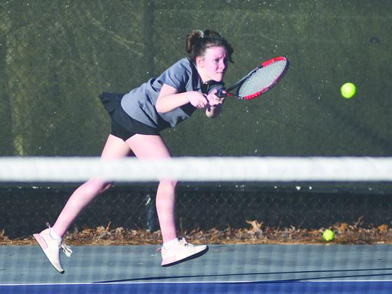 Gilmer High’s Morgan White returns a serve and is one of five Lady Cat senior starters who helped the team reach the state tournament.