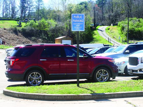Above, a Spring Street lot normally used by courthouse employees has been opened to public parking on weekends.