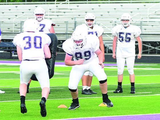 Gilmer High offensive linemen work on shedding defenders to get to the second level to block linebackers at spring football practice last Wednesday.