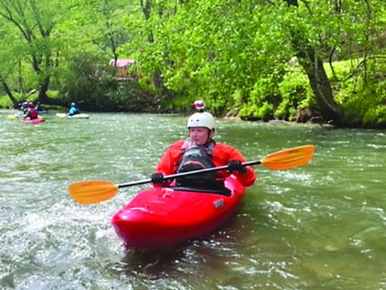 Vietnam veteran Dennis Walters, a Team River Runner charter member, is shown paddling down the river.