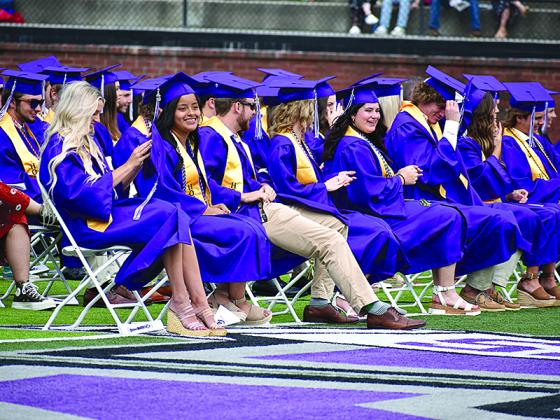 The Gilmer High School Class of 2021 share a few laughs during their commencement ceremony Saturday, May 29, at Huff-Mosley Memorial Stadium.