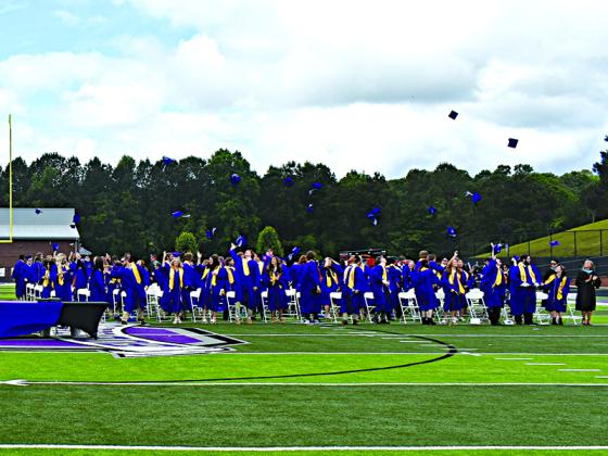 The Gilmer High School Class of 2021 completes their commencement ceremony with the cap toss Saturday, May 29, at Huff-Mosley Memorial Stadium.