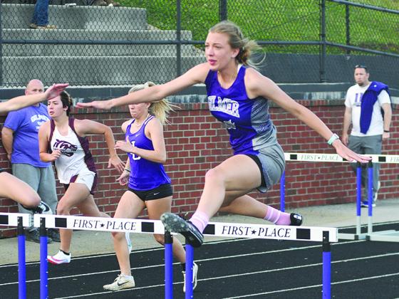 Emily Hancock clears a hurdle during her senior season at Gilmer High and will soon make her way to Marietta to join the track team at Life University.