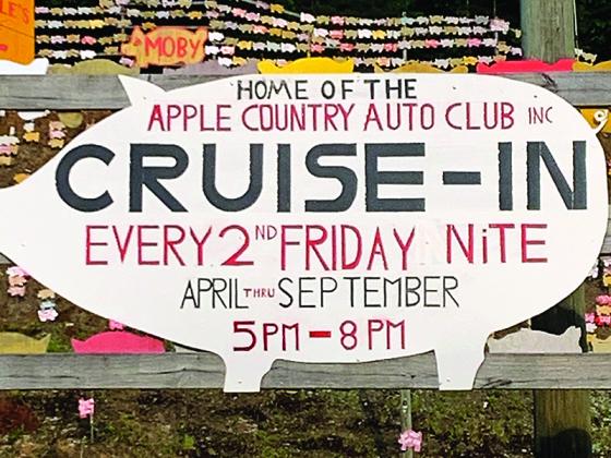 A new sign in front of the “Pig Hill of Fame” at Poole’s Bar-B-Q promotes the Apple Country Auto Club’s monthly car cruise-ins. 