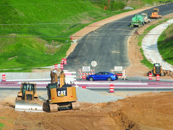 The northbound and southbound lanes of Old Highway 5 are accommodating traffic as a new roundabout is under construction.