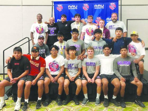 Above are Gilmer High’s wrestlers and coaches at the conclusion of the Disney Duals held in Orlando.