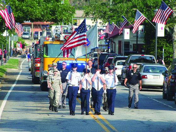 Cadets and personnel from Gilmer’s 507th Civil Air Patrol Composite Squadron lead the Independence Day Parade up River Street Sunday, July 4. Downtown Ellijay saw a large turnout for the parade, as well as live music and vendors, followed by fireworks at dark. 
