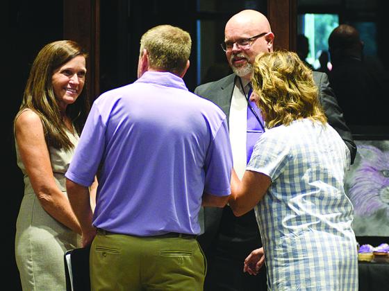 New superintendent Dr. Brian Ridley (second from right) is joined by assistant superintendent Kim Cagle (left) during a welcome reception last Thursday.