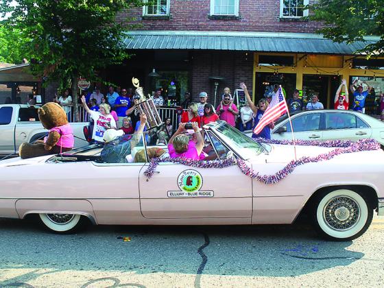 First-place trophy winning float in the Ellijay Fourth of July Parade were, in the commercial category, Moo-Bears Ice Cream with their vintage pink Cadillac and travel trailer.