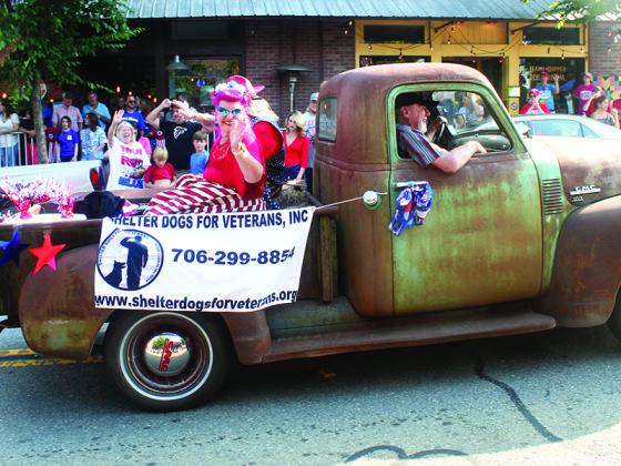 Shelter Dogs For Veterans volunteers Jon and Michelle Vigue driven in Dwight Sanford’s 1950 GMC pickup.