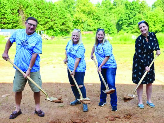 From left, Ken Fillman, Cassie Rasco and Jessica Wells, of the Boys and Girls Clubs of North Georgia, join Gilmer Chamber President Jennifer Grimmer in breaking ground for a playground at the new Boys and Girls Club site on Progress Road.