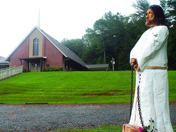 A statue of Jesus Christ made by local chain saw carver Mike Duke watches over Cartecay United Methodist Church.