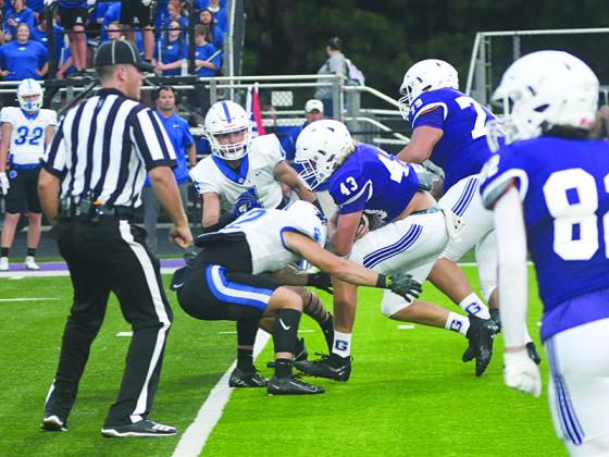 Gilmer fullback Brock Titus bulls his way through Ringgold’s secondary last Friday, and he finished the game with a pair of rushing touchdowns.