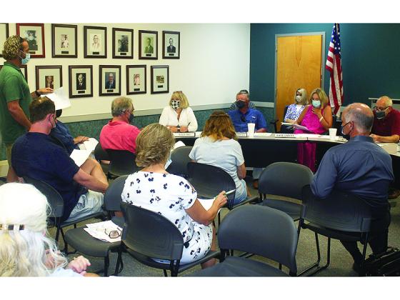 The Ellijay City Council and Mayor Al Hoyle heard concerns from a number of local residents about a proposed short-term rental ordinance when meeting Monday. Tom Griffith, standing, is shown speaking to Hoyle, right, and councilmembers Sandy Ott, Tom Crawford and Katie Lancey. 