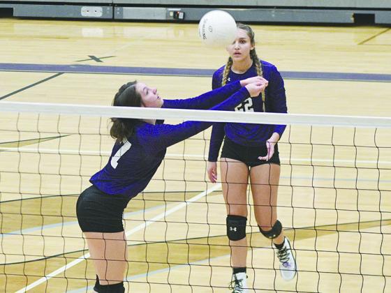 Gilmer High setter Adrian Thompson keeps a rally alive for the Lady Cats during a home match.