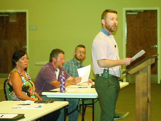Ellijay Downtown Development Authority members Reece Sanford, standing, Ellen Grant, Keith Nunn and Josh Moyers heard feedback from local businessowners and residents during a town hall meeting at the First Baptist Church Fellowship hall last week. 