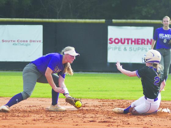 Gilmer High senior shortstop Taylor Elliott makes the tag at second base for an out after receiving the throw from catcher Maddie Wright last Thursday. Elliott totaled five hits and knocked in five runs last week.