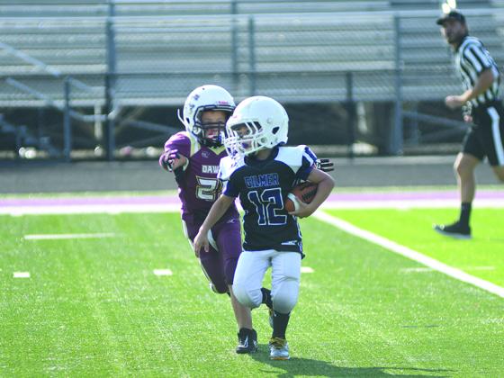 Maddox Brumfield (12) of the first-grade Bobcats finds some running room and scored two touchdowns in Gilmer’s 26-0 win over Fannin last Saturday.