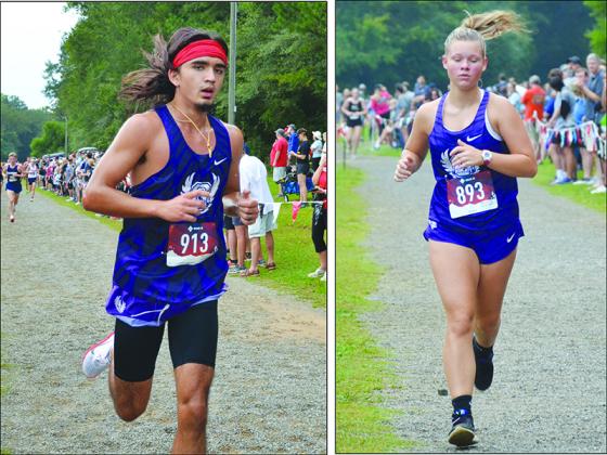 From left, are Gilmer High cross-country runners Carson Purvis and Laney Hensley at last Saturday’s Warpath Invitational.