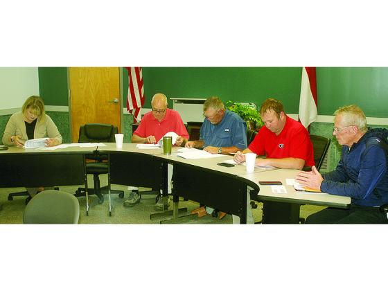 Mayor Al Hoyle, second from left, and Ellijay City Councilmembers Sandy Ott, Tom Crawford, Kevin Pritchett and Al Fuller review the city’s proposed 2022 operating budget during a special called meeting last week.  