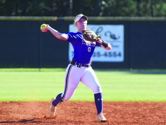 Gilmer High School infielder Taylor Elliott makes a throw to first and was one of four Lady Cat seniors on this year’s team.