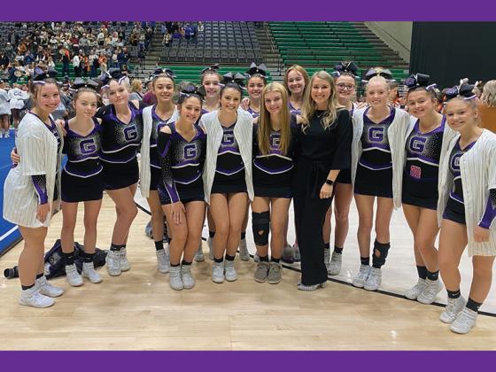 Gilmer High school cheerleaders and head coach Namoi Esparza gather for a picture following their fourth-place finish at the region competition.