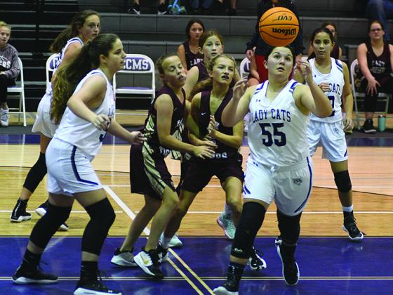 Clear Creek’s Madison Hall (55) gathers a defensive rebound during the seventh-grade game versus Dawson County.
