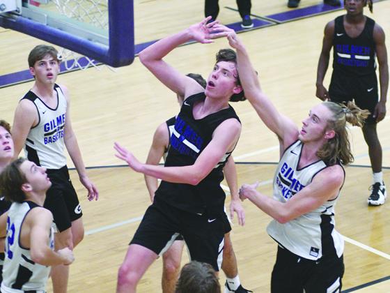 Gilmer High seniors Lewis Mulkey (center in black) and Cade Carter (right in white) will be the focal points of the Bobcats’ offense this season.