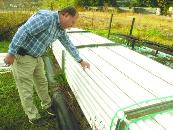 Gary McVey, Ellijay-Gilmer County Water and Sewerage Authority director, is pictured with a stockpile of PVC pipe, a standard item that multiple local departments are having trouble getting due to supply chain issues. McVey said the water authority purchased the pipe some time ago, but it would be hard to get that much right now. 