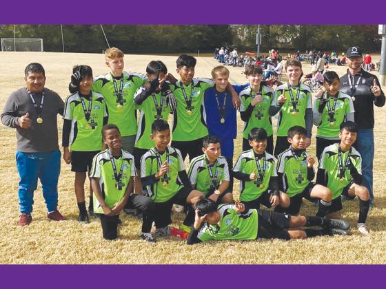Above are coaches and players of TRAC Elite. In front is Adriel Reynoso, and second row from left, are Kashane Perigo, Marvin Felipe, Iker Rangel, Jason Perez Lopez, Gabriel Reynoso and Christian Perez Lopez. Back row are assistant Miguel Reynoso, Willian Ramirez, Rylen Haley, Bryan Perez Lopez, Brayner Ortiz, Landon Hamby, Carter Gearhart, Zane Davis, Frankie Gomez and head coach Todd Gearhart.