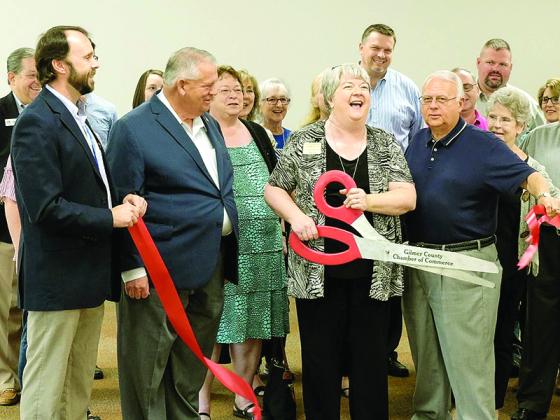 Anita Summers cuts the red ribbon at a 2019 unveiling of the newly renovated basement  of the Gilmer County Library, now used as a class and meeting space. Pictured in front, from left: then-library manager Heath Lee, Georgia House Speaker David Ralston, Summers and library trustee board member Paul Nealey.