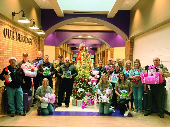 Clear Creek Elementary staff receive toys for students from Gilmer, Fire and Rescue and the Ellijay Fire Department last week. 