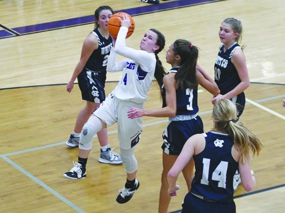 Robbie Bills/Sports Editor Gilmer High point guard Charley Poteet drives for two points versus White County last Friday.
