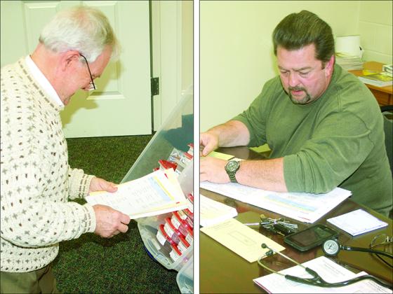 Claude Mathis, of the Morganton-Mountaintown Baptist Association, left, and Dr. Richard Tanner, right, are shown assisting patients during a free medical clinic at Pleasant Grove Baptist Church. 