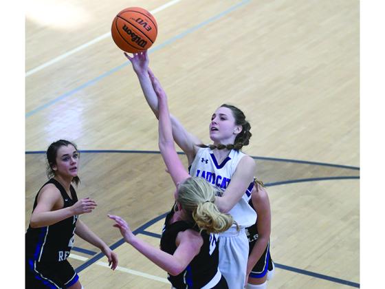Gilmer High’s Aliza Chastain draws a foul and was one of eight players who scored points in the Lady Cats’ win over Southeast Whitfield.