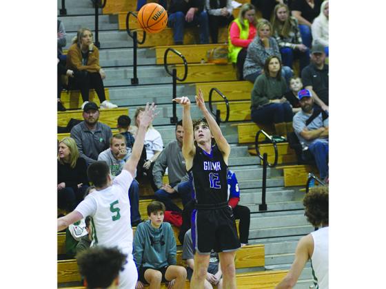 Gilmer’s Christian Sumner launches a three pointer and scored 16 points versus White County last week.