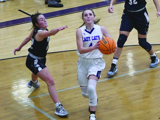 Lady Cat Aliza Chastain drives to the basket and scored 14 points in Gilmer’s victory over Trion last Thursday.